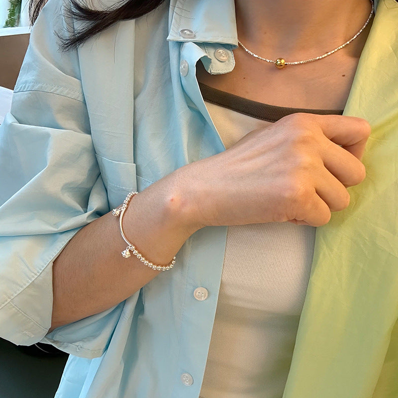 Silver bell curved tube bead bracelet made of 925 sterling silver, elegantly designed for young, fashionable women.