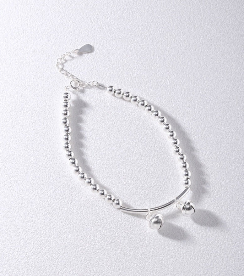 Silver bell curved tube bead bracelet made of 925 sterling silver, elegantly designed for young, fashionable women.