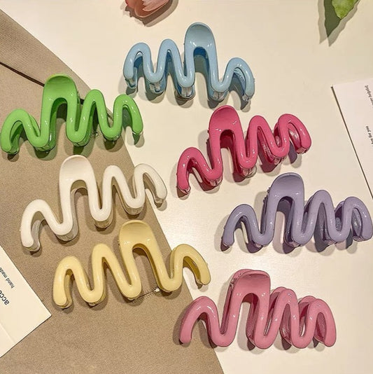 Candy-colored Wavy Hair Claw Clip made of premium acrylic, showcasing a playful wavy design in vibrant hues, approximately 10.5cm in length.