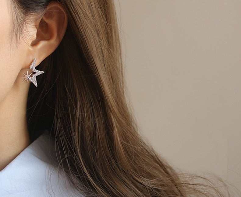 Gold-Plated Starry Zirconia Stud Earrings with star-shaped settings and 925 silver ear pins, weighing 1.6g each, measuring 1.8cm by 2.1cm.