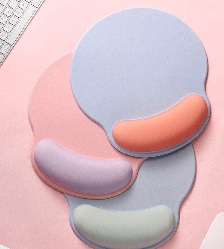 An ergonomic memory foam mouse pad with wrist support and a non-slip base, measuring 25x22 cm.