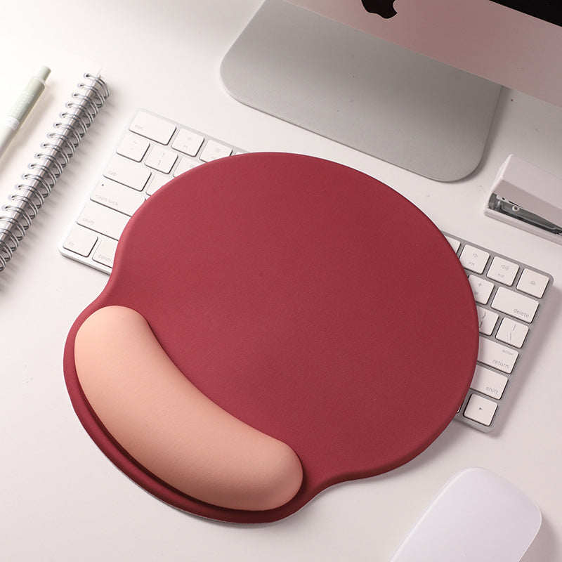 An ergonomic memory foam mouse pad with wrist support and a non-slip base, measuring 25x22 cm.