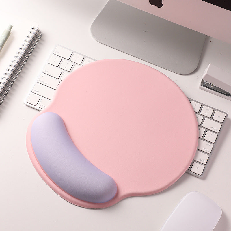 An ergonomic memory foam mouse pad with wrist support and a non-slip base, measuring 25x22 cm.