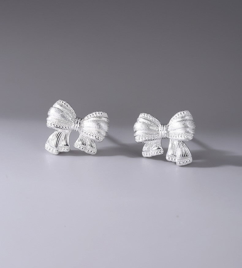 Sterling Silver Asymmetric Mattified Bow Tie Ear Studs