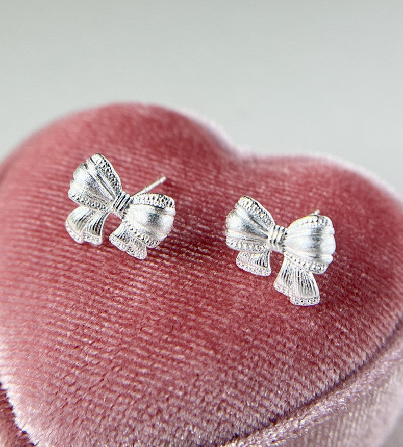 Sterling Silver Asymmetric Mattified Bow Tie Ear Studs