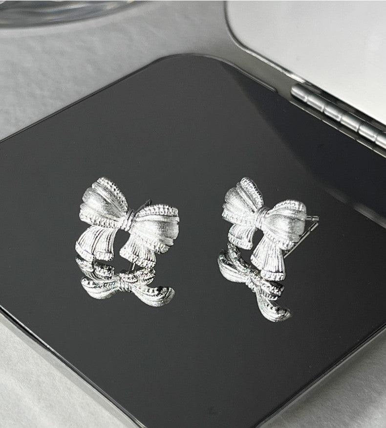 Sterling Silver Asymmetric Mattified Bow Tie Ear Studs