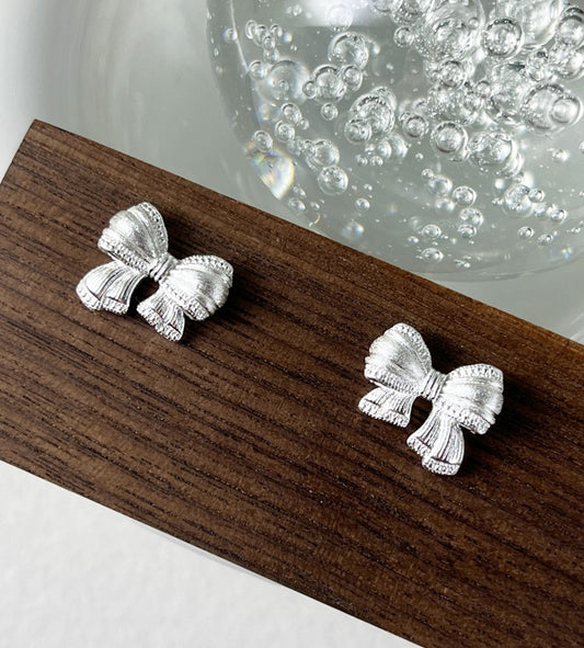 Sterling Silver Asymmetric Mattified Bow Tie Ear Studs