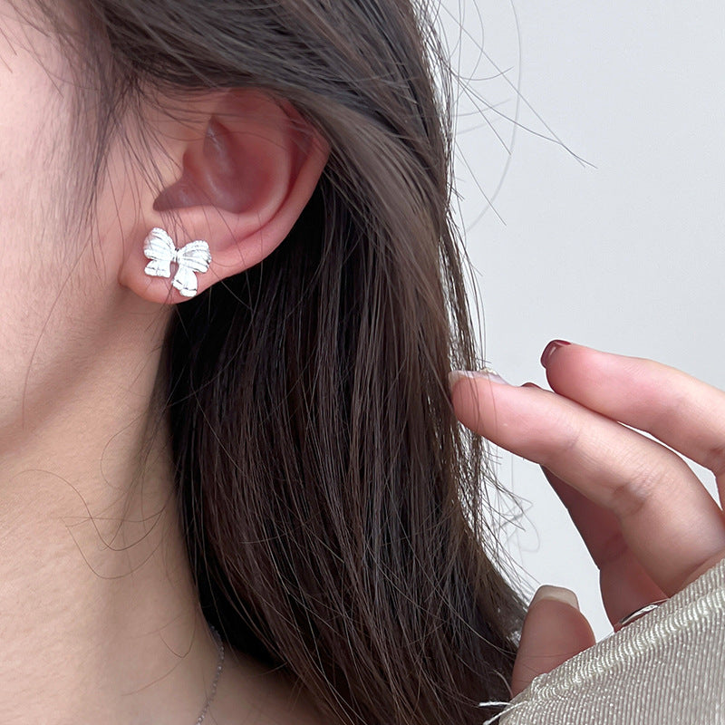 Sterling Silver Asymmetric Mattified Bow Tie Ear Studs