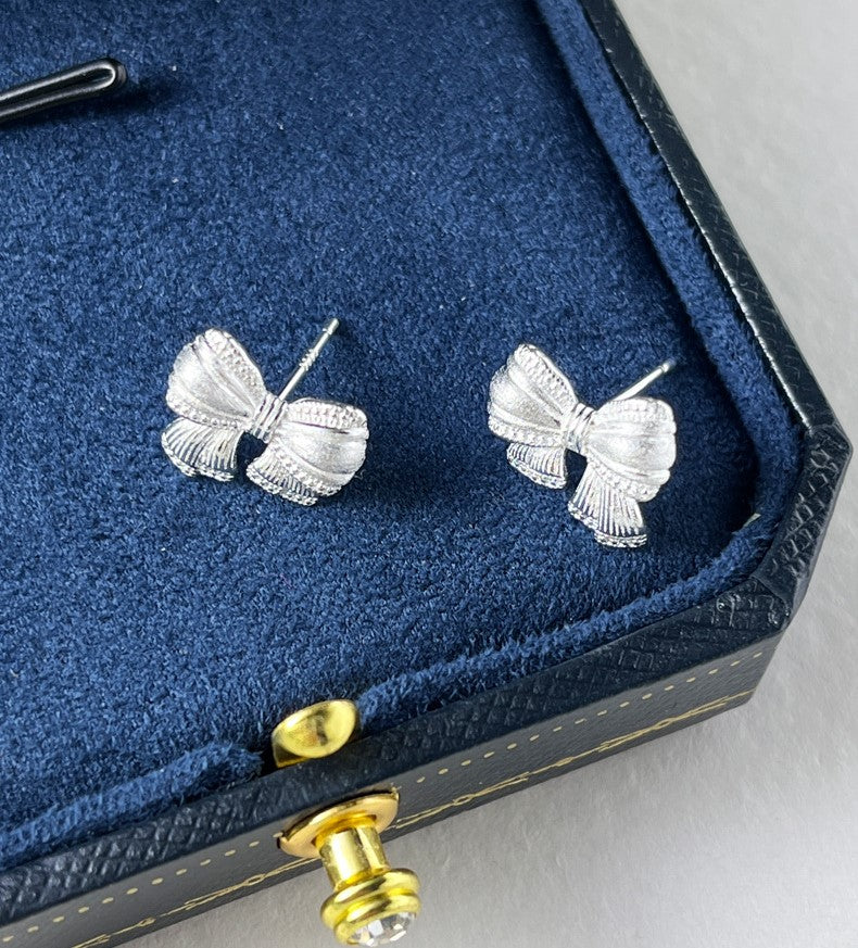 Sterling Silver Asymmetric Mattified Bow Tie Ear Studs