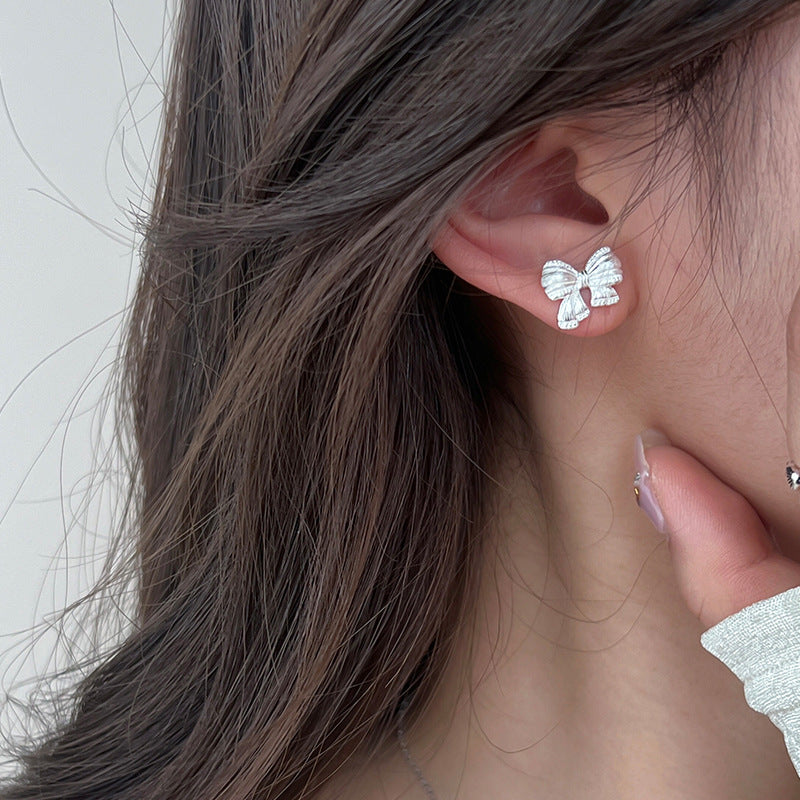 Sterling Silver Asymmetric Mattified Bow Tie Ear Studs