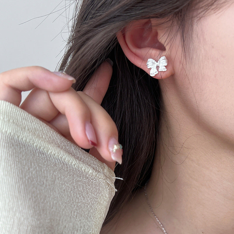 Sterling Silver Asymmetric Mattified Bow Tie Ear Studs