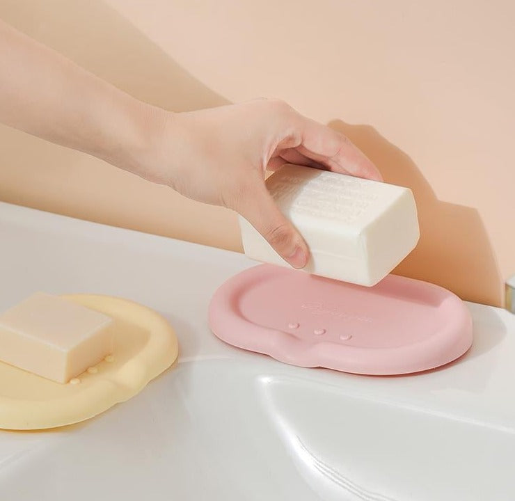 Silicone Drainage Soap Holder - A colorful and sleek soap holder made from durable silicone with a unique drainage design for proper ventilation and moisture prevention. Perfect for a stylish and functional bathroom or kitchen accessory