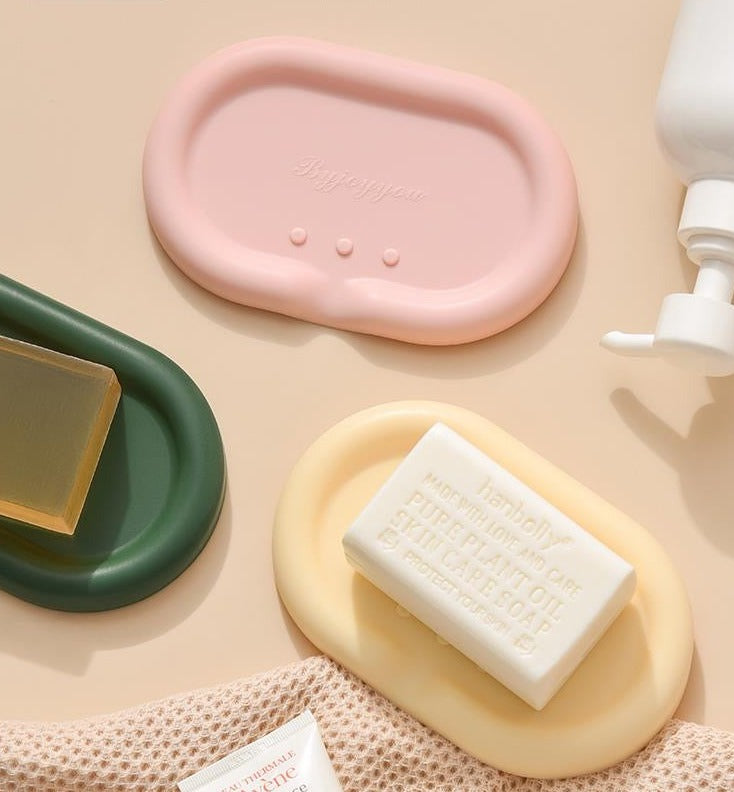 Silicone Drainage Soap Holder - A colorful and sleek soap holder made from durable silicone with a unique drainage design for proper ventilation and moisture prevention. Perfect for a stylish and functional bathroom or kitchen accessory