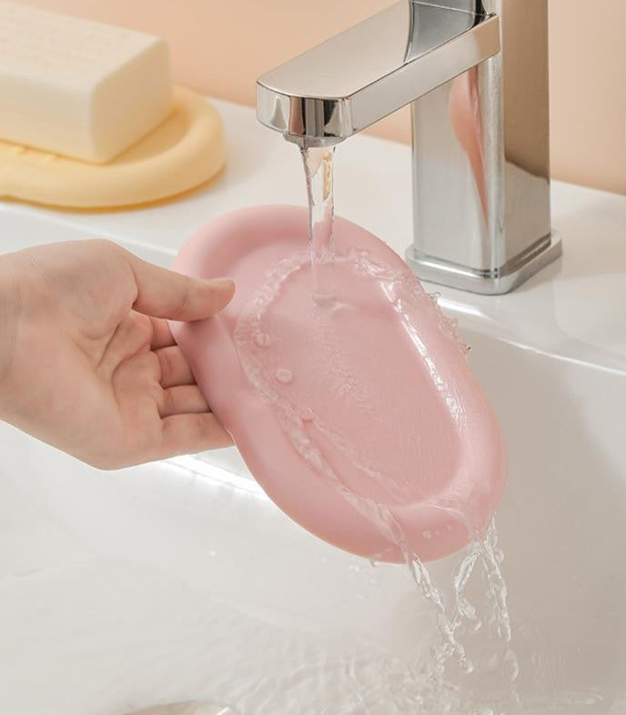Silicone Drainage Soap Holder - A colorful and sleek soap holder made from durable silicone with a unique drainage design for proper ventilation and moisture prevention. Perfect for a stylish and functional bathroom or kitchen accessory