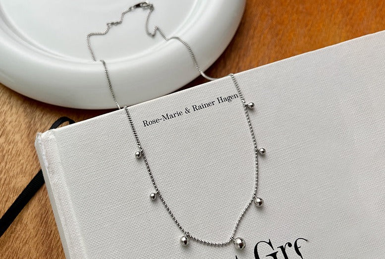 Silver Spaced Bead Necklace made of 925 sterling silver, featuring delicately spaced small round beads, with an adjustable length of approximately 40cm plus a 2cm extension.