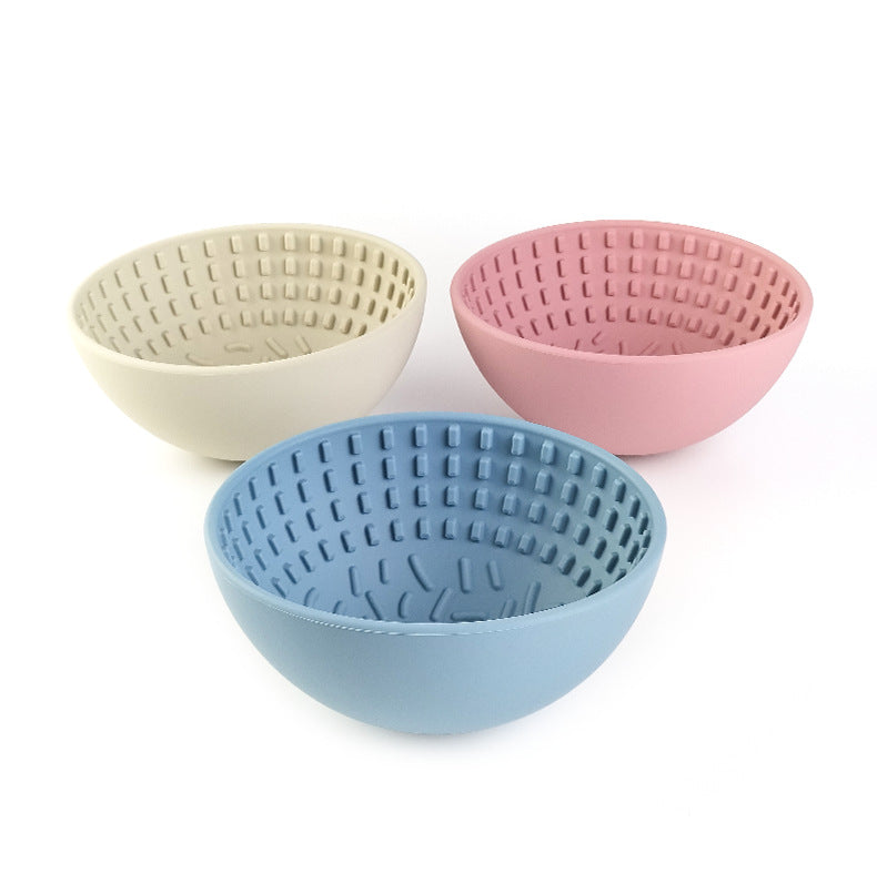 Wobbler Slow Feeder Bowl made of food-grade silicone, featuring a unique wobbling design and a textured licking pad for improved oral health, in a size of 16.5cm x 8cm with a capacity of 880ml.