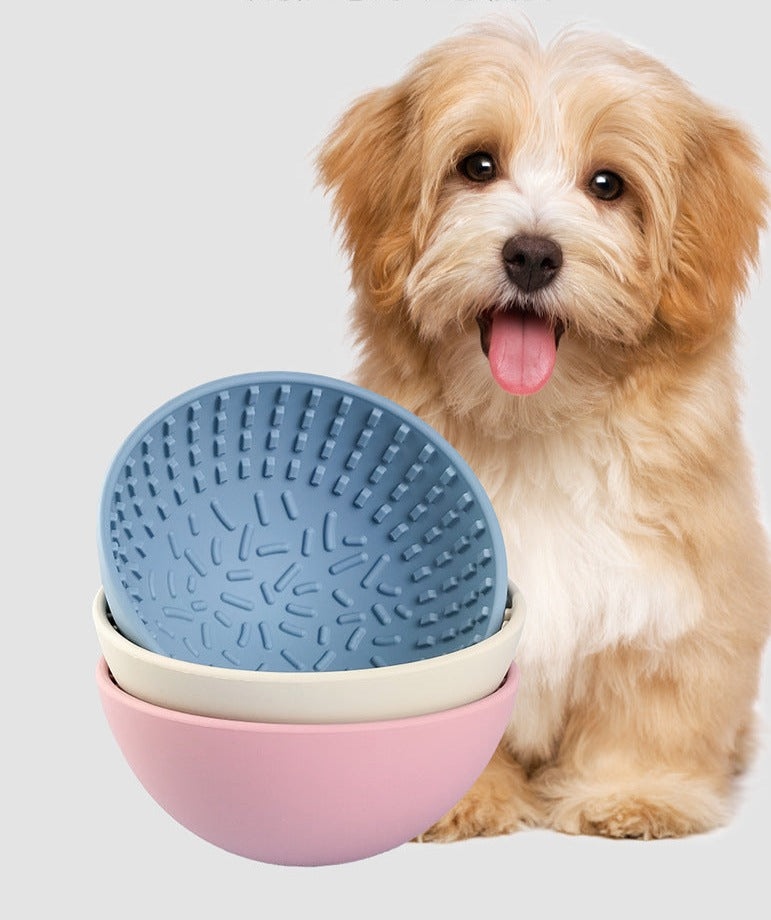 Wobbler Slow Feeder Bowl made of food-grade silicone, featuring a unique wobbling design and a textured licking pad for improved oral health, in a size of 16.5cm x 8cm with a capacity of 880ml.