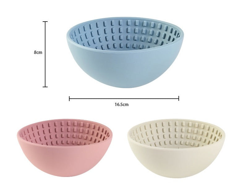 Wobbler Slow Feeder Bowl made of food-grade silicone, featuring a unique wobbling design and a textured licking pad for improved oral health, in a size of 16.5cm x 8cm with a capacity of 880ml.