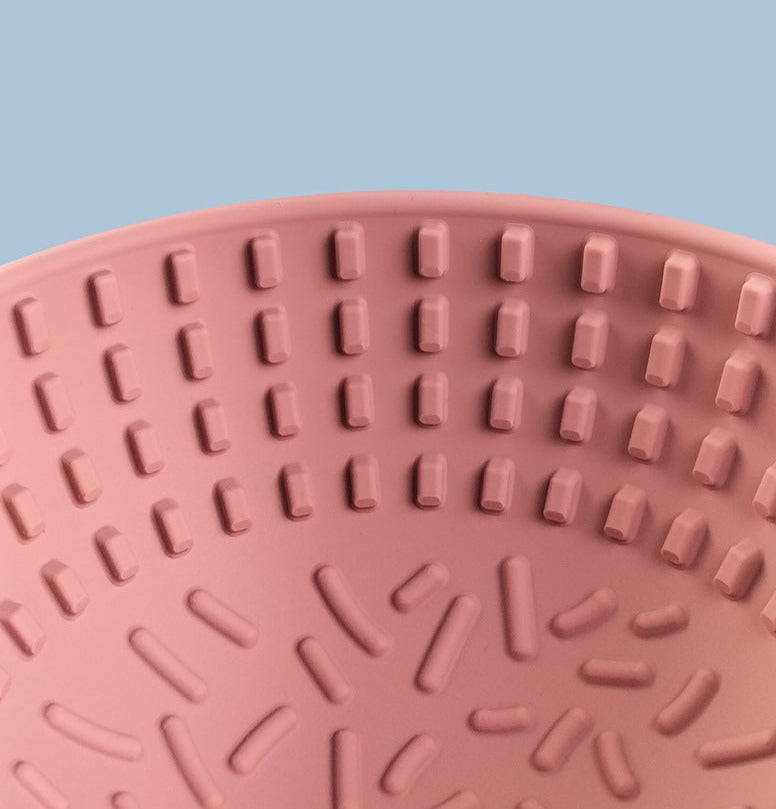 Wobbler Slow Feeder Bowl made of food-grade silicone, featuring a unique wobbling design and a textured licking pad for improved oral health, in a size of 16.5cm x 8cm with a capacity of 880ml.