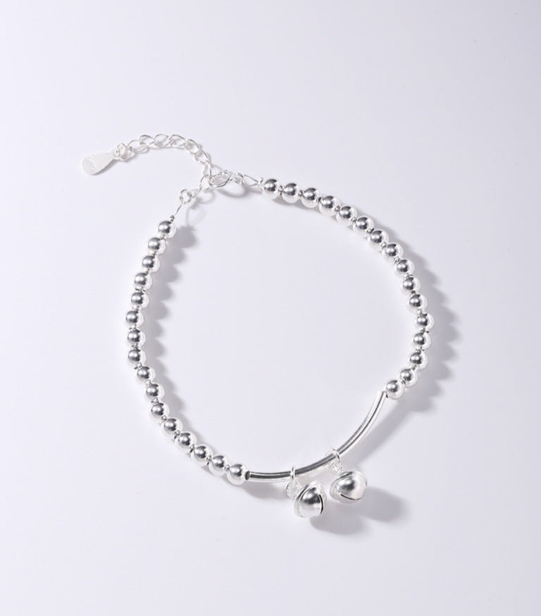 Silver bell curved tube bead bracelet made of 925 sterling silver, elegantly designed for young, fashionable women.