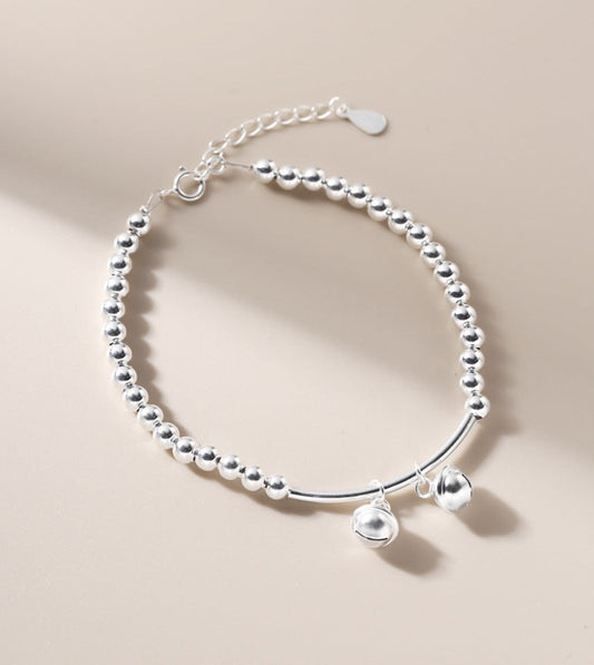 Silver bell curved tube bead bracelet made of 925 sterling silver, elegantly designed for young, fashionable women.