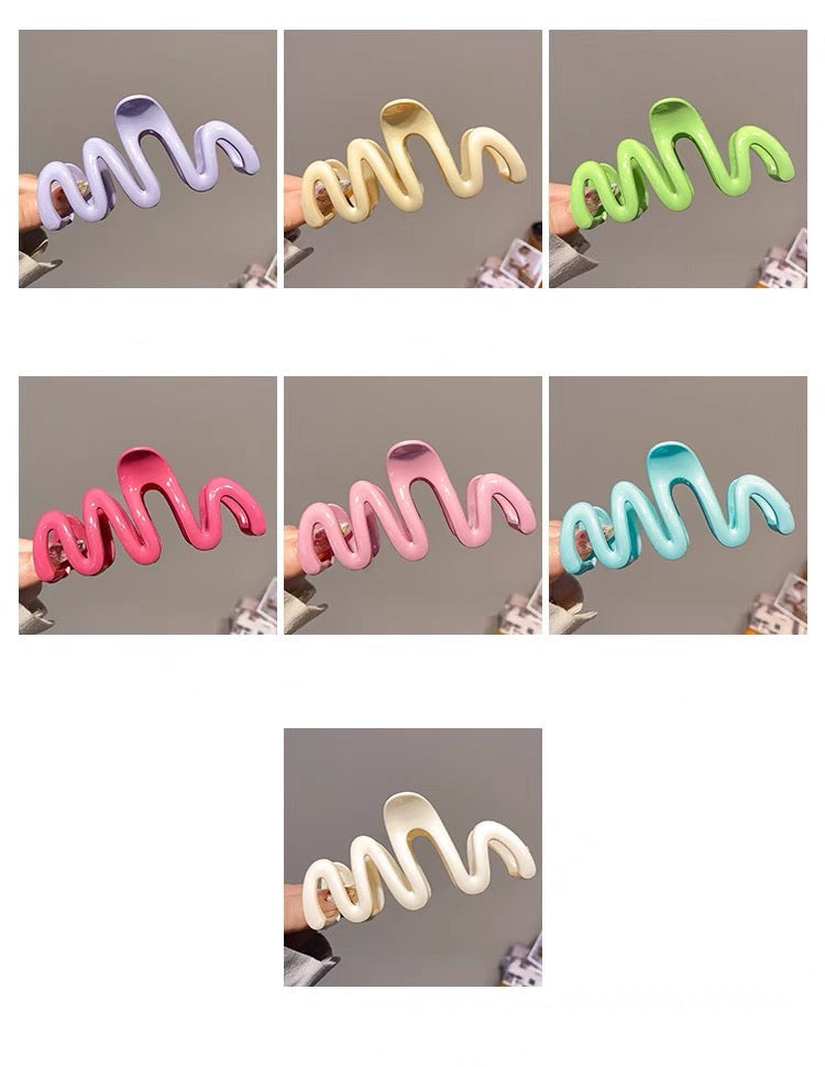 Candy-colored Wavy Hair Claw Clip made of premium acrylic, showcasing a playful wavy design in vibrant hues, approximately 10.5cm in length.