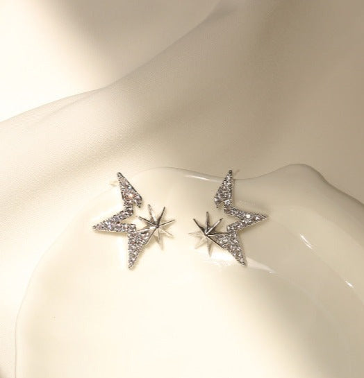 Gold-Plated Starry Zirconia Stud Earrings with star-shaped settings and 925 silver ear pins, weighing 1.6g each, measuring 1.8cm by 2.1cm.