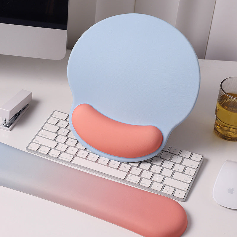 An ergonomic memory foam mouse pad with wrist support and a non-slip base, measuring 25x22 cm.