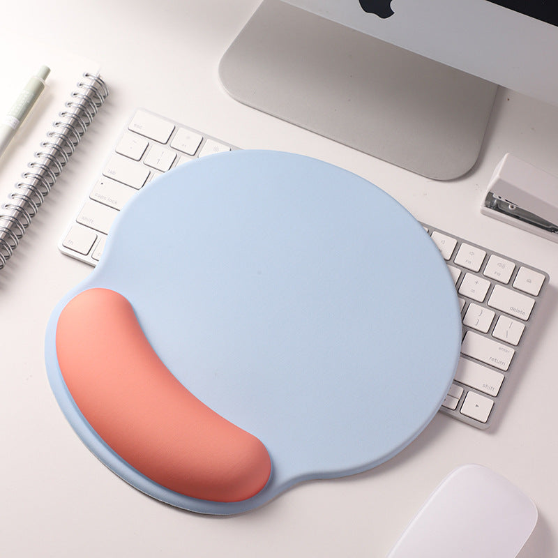 An ergonomic memory foam mouse pad with wrist support and a non-slip base, measuring 25x22 cm.