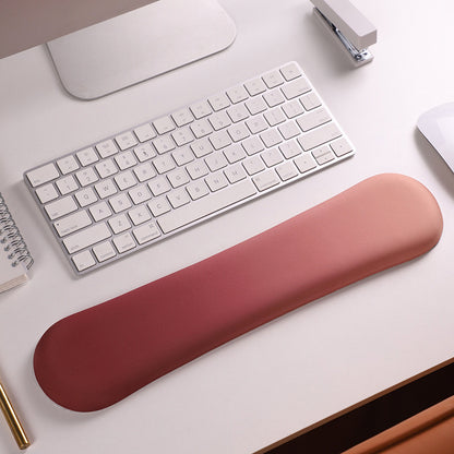 Memory foam wrist rest pad with soft cover.