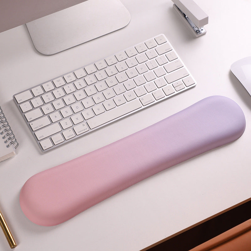 Memory foam wrist rest pad with soft cover.