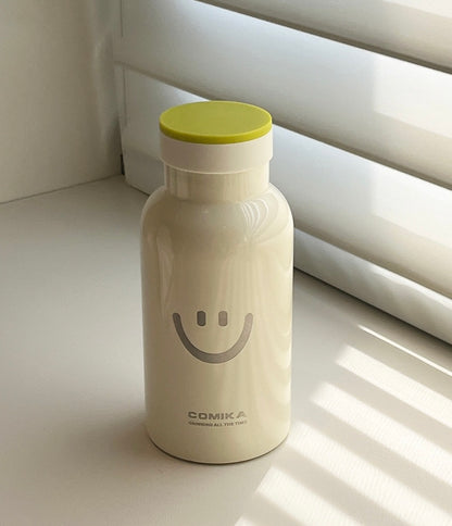 Yellow Smiley Face Thermal Bottle with a stainless steel inner lining, designed to keep beverages hot or cold. Iconic smiley face emblem prominently displayed on the front.