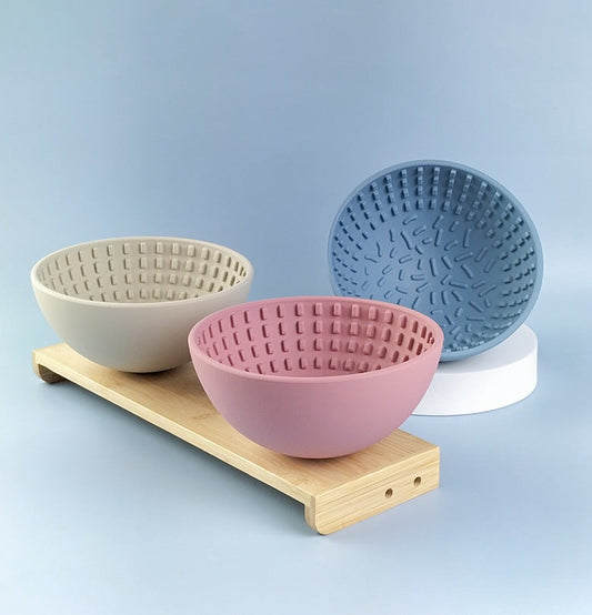 Wobbler Slow Feeder Bowl made of food-grade silicone, featuring a unique wobbling design and a textured licking pad for improved oral health, in a size of 16.5cm x 8cm with a capacity of 880ml.